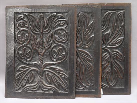 Three carved oak panels 38 x 29cm